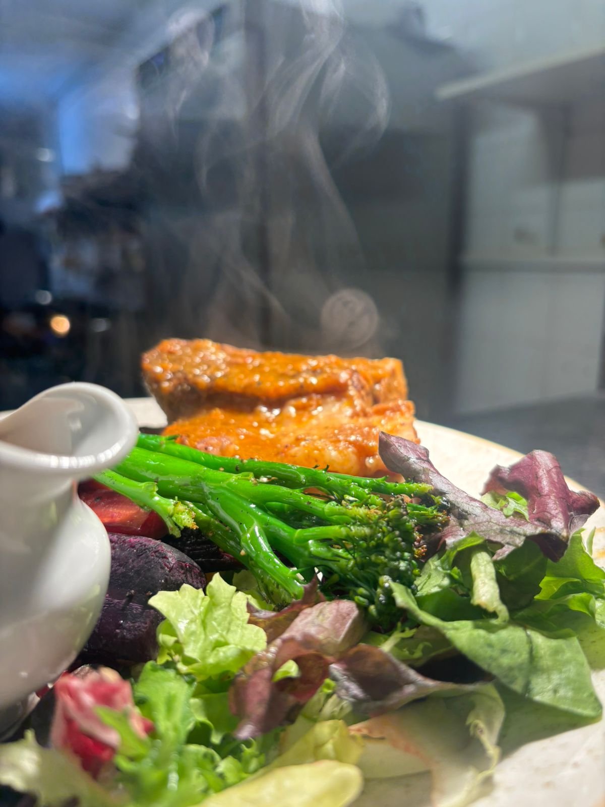 Roast fish with greens and fresh salad